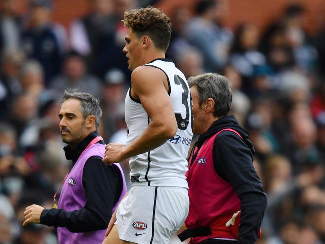 Charlie Curnow of the Blues comes off the field after an injury during the Round 2 AFL match between Port Adelaide Power and the Carlton Blues at the Adelaide Oval, Adelaide, Saturday, March 30, 2019. (AAP Image/David Mariuz) NO ARCHIVING, EDITORIAL USE ONLY