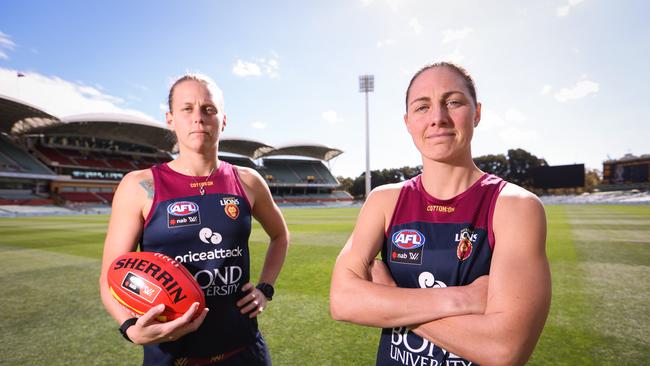 Kate Lutkins (L) &amp; Rheanne Lugg are both serving members of the ADF and players for the Brisbane Lions. Saturday will see them face off against the Adelaide Crows in the AFLW Grand Final held at the Adelaide Oval. Picture: James Elsby