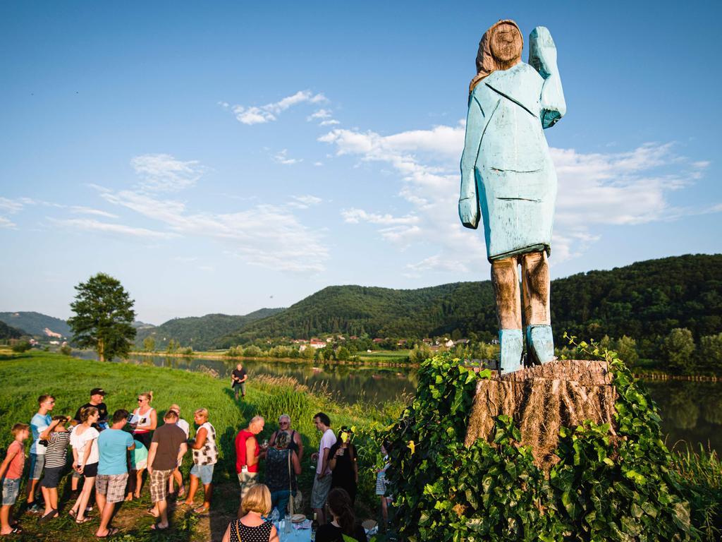 People gather around what conceptual artist Ales 'Maxi' Zupevc claims is the first ever monument of Melania Trump. Picture: Jure Makovec/AFP