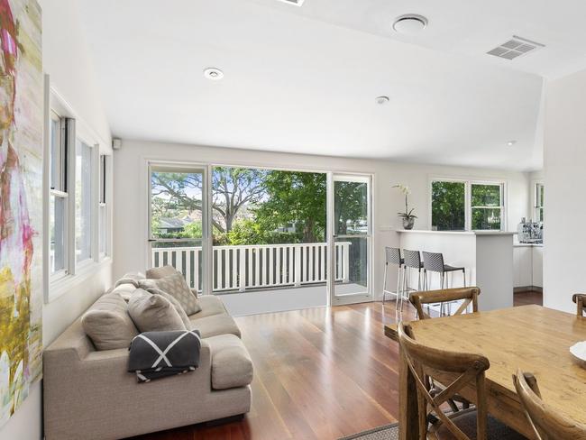 The living/dining room flows out to a large deck. 