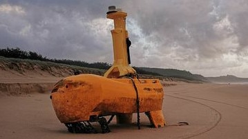 A mystery yellow object has washed up on Teewah Beach with speculation rife online as to its use. Picture: Geoff Feeley