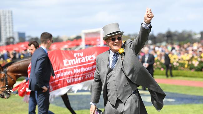 Owner Lloyd Williams gestures with Rekindling after winning the 2017 Melbourne Cup at Flemington Racecourse in Melbourne on Tuesday, November 7, 2017. (AAP Image/Julian Smith) NO ARCHIVING