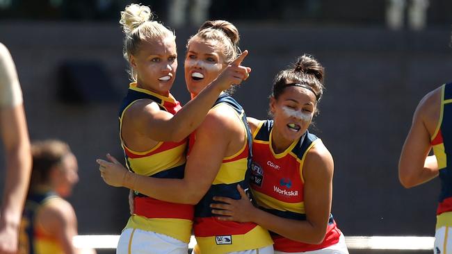 Erin Phillips, Abbey Holmes and Stevie-Lee Thompson of the Crows.