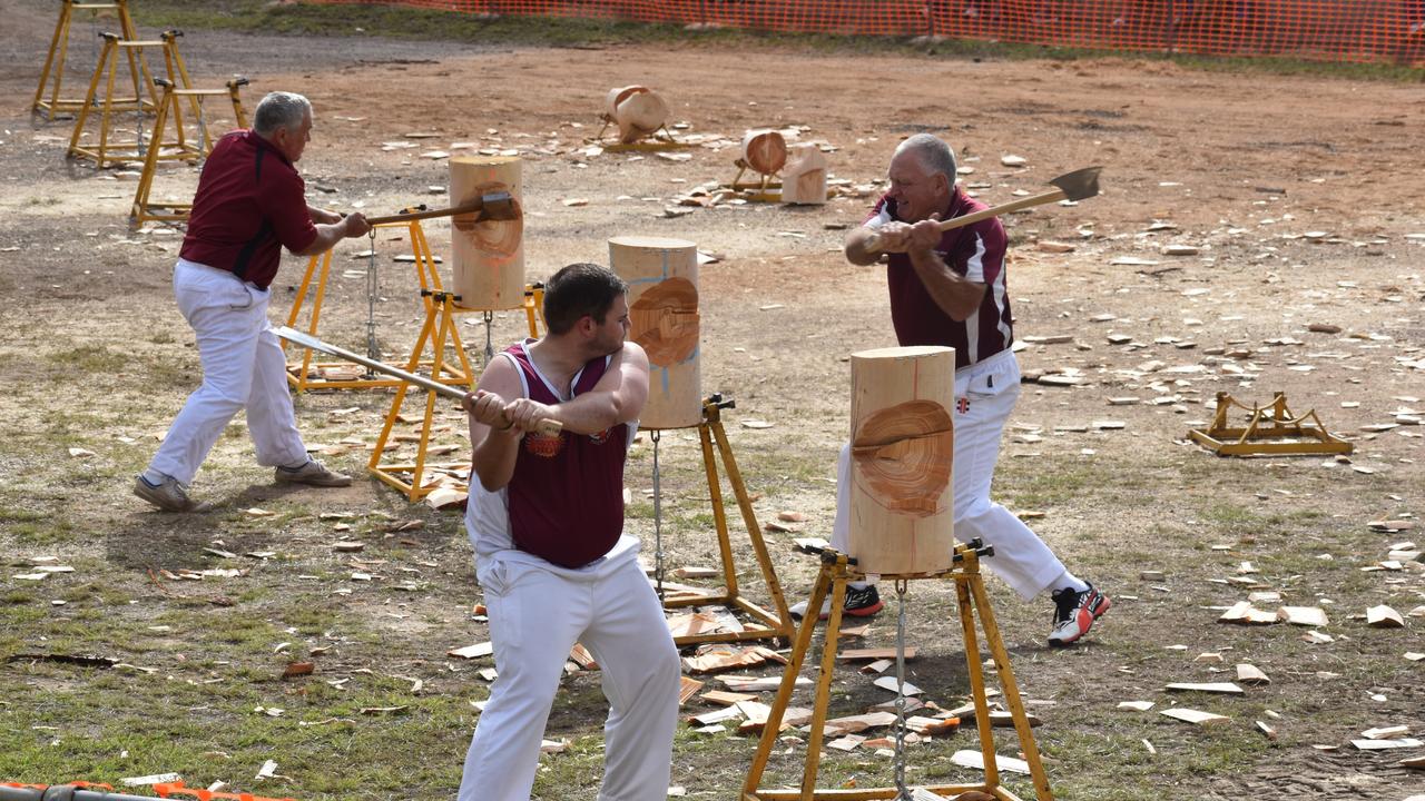 (L) Wood chop competitors Craig Wagner, Phil Campbell and Tom Wilkinson compete at the Fraser Coast Ag Show. Photo: Stuart Fast