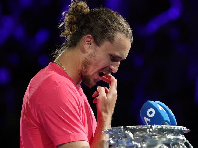 Germany's Alexander Zverev prepares to address the crowd after defeat against Italy's Jannik Sinner during their men's singles final match on day fifteen of the Australian Open tennis tournament in Melbourne on January 26, 2025. (Photo by DAVID GRAY / AFP) / -- IMAGE RESTRICTED TO EDITORIAL USE - STRICTLY NO COMMERCIAL USE --