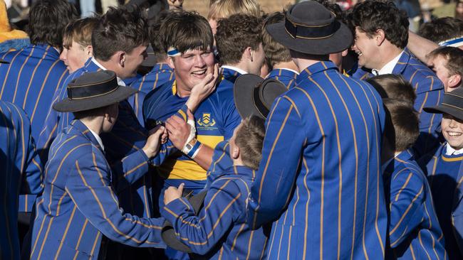 Grammar captain Charlie Wigan congratulated by TGS students. Picture: Nev Madsen.