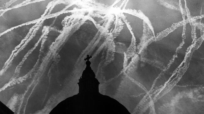 Evidence of duelling fighter planes fills the London sky above St Paul's Cathedral during the Battle of Britain in 1940.