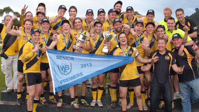 Coach Justin McConnell (left) and captain Adam Kurzman display North Gambier's flag in 2013. Picture: Frank Monger