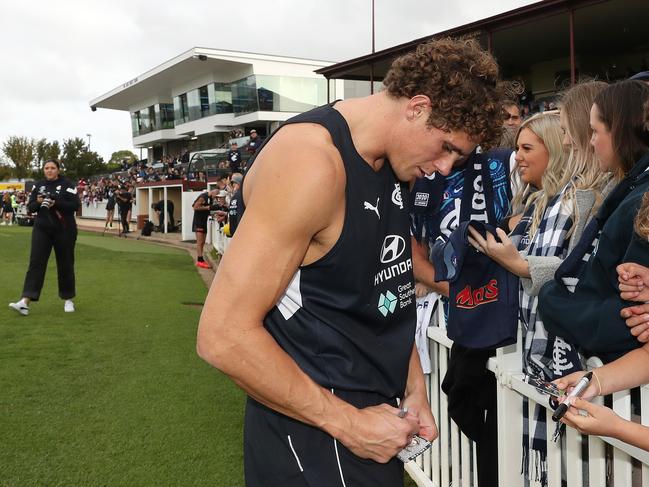 ADELAIDE - APRIL 12: Charlie Curnow of the Blues signs autographs during a Carlton Blues AFL training session at Unley Oval on April 12, 2023 in Adelaide, Australia. (Photo by Sarah Reed/AFL Photos via Getty Images)