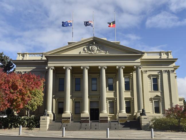 Flags flying half mast at City Hall. Marchers took part in an Anzac Parade through Malop Street to Johnstone Park on Anzac Day. Crowds lined the street but there were none of the usual formalities at the finale. Picture: Alan Barber