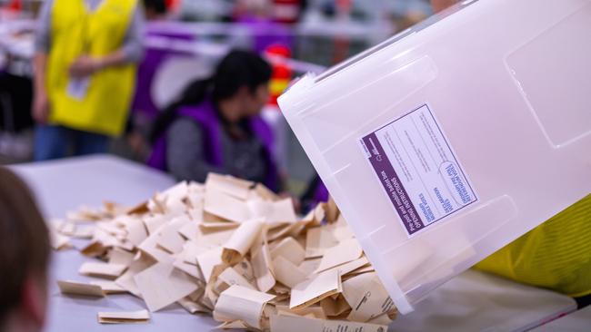 Ballot papers are placed onto a table prior to being counted in Melbourne.