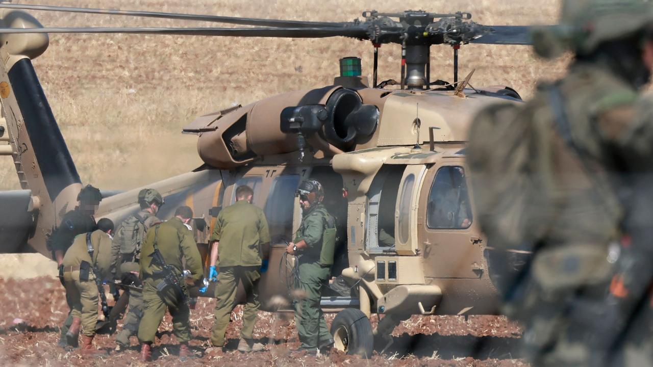 Israeli forces evacuate a wounded soldier in a Black Hawk helicopter in the Israeli town of Muqeibila, north of the occupied West Bank, on July 3, 2023. (Photo by Menahem KAHANA / AFP)