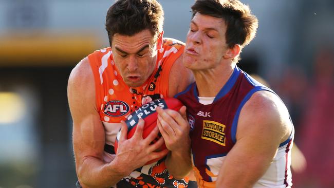 Greater Western Sydney's Jeremy Cameron hits heads with Brisbane Lions' Justin Clarke. Picture: Phil Hillyard.