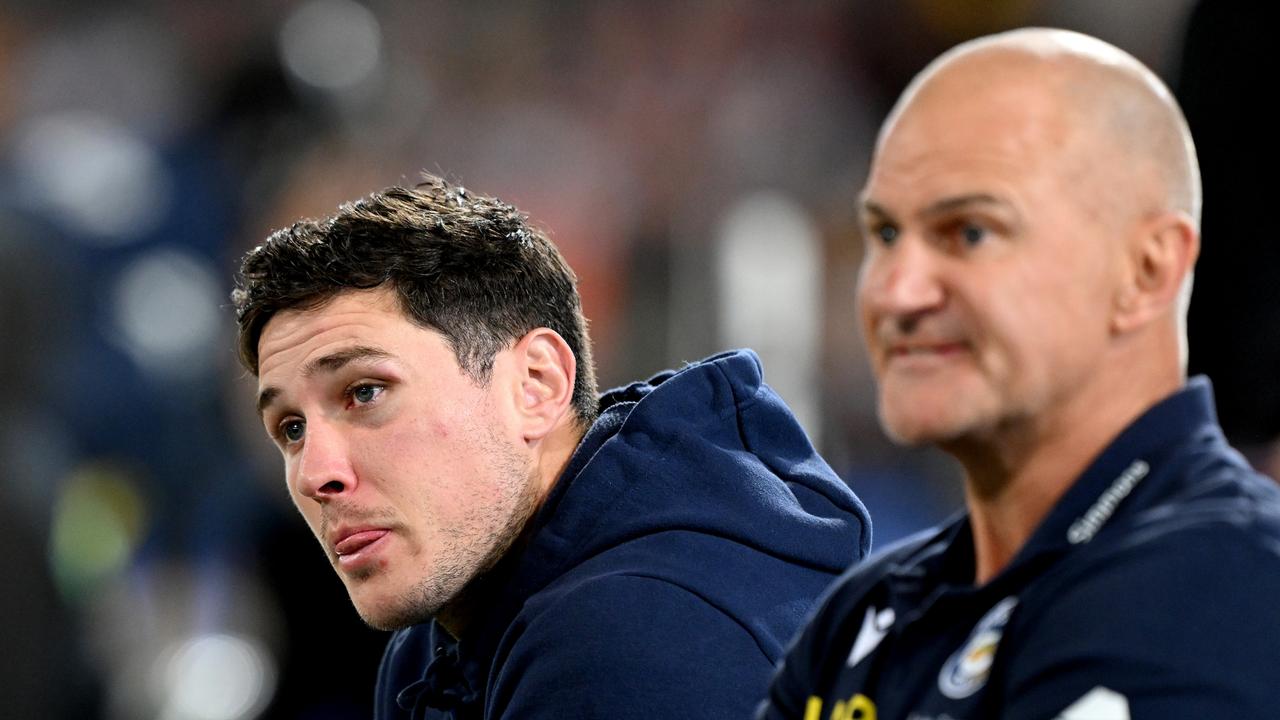 BRISBANE, AUSTRALIA - AUGUST 11: Mitchell Moses of the Eels is seen alongside Coach Brad Arthur and looking dejected after sustaining an injury during the round 24 NRL match between the Brisbane Broncos and Parramatta Eels at The Gabba on August 11, 2023 in Brisbane, Australia. (Photo by Bradley Kanaris/Getty Images)