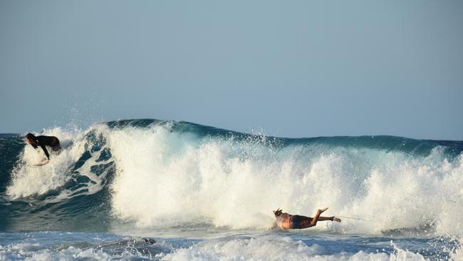Surfers catchnig the waves stirred up by Tropical Cyclone Oma. Picture: Mark Furler.