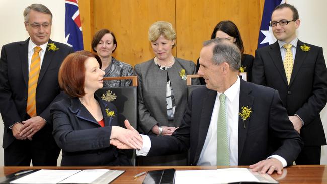 Then prime minister Julia Gillard and Greens leader Bob Brown shake on their power-sharing agreement in 2010. Picture: AAP