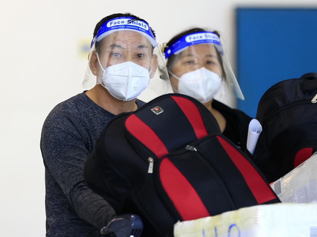 Hung Dau and Oanh Pham arrive at Brisbane International Airport on a flight from Singapore. Picture: Adam Head