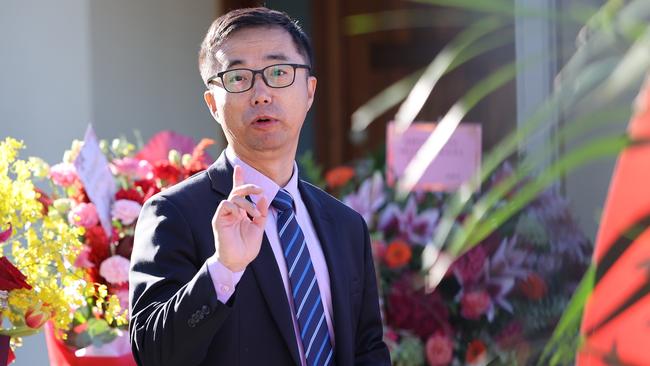 A Chinese official inside the South Australian Chinese consulate in Adelaide during the protest. Picture: Picture: NCA NewsWire / David Mariuz