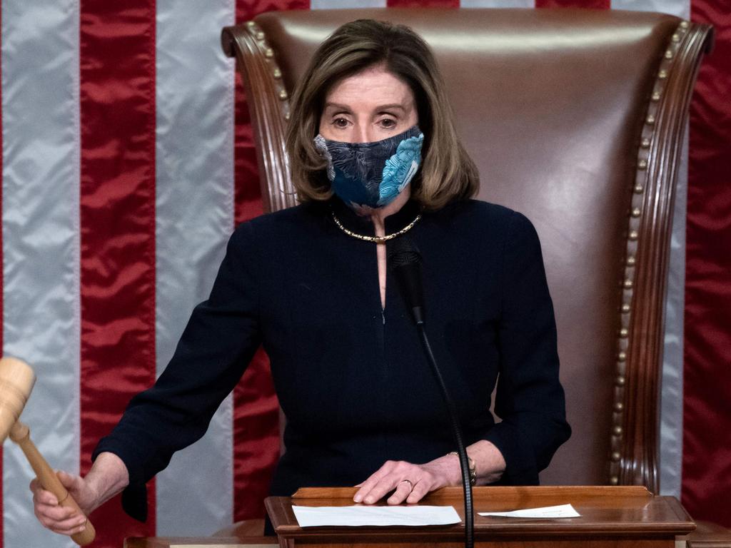 Speaker of the House Nancy Pelosi puts down the gavel as she announces US President Donald Trump has been impeached for a second time. Picture: AFP