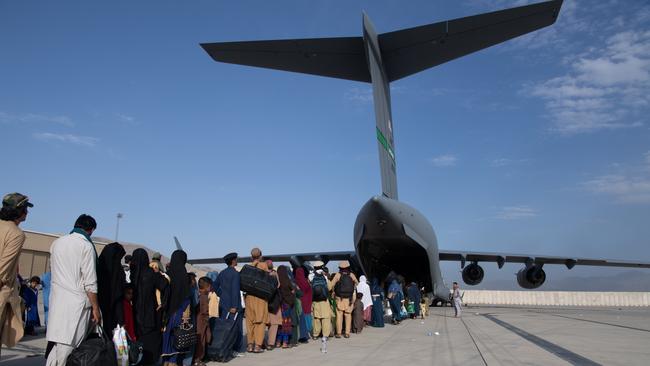 In this handout provided by U.S. Central Command Public Affairs, U.S. Air Force loadmasters and pilots assigned to the 816th Expeditionary Airlift Squadron, load passengers aboard a U.S. Air Force C-17 Globemaster III in support of the Afghanistan evacuation at Hamid Karzai International Airport (HKIA) on August 24, 2021 in Kabul, Afghanistan. The United States and allies urged Afghans to leave Kabul airport, citing the threat of terrorist attacks, as Western troops race to evacuate as many people as possible by August 31. (Photo by Master Sgt. Donald R. Allen/U.S. Air Forces Europe-Africa via Getty Images)