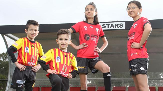 Future Soccer Stars and current MetroStars Juniors, Leo Spagnuolo, 7, and his young brother Ollie, 4, with Metro United U13 players Aaliyah Gonsalves, 12, Madi Alaia, 12. Picture: Dean Martin