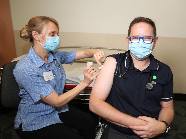 Associate Professor Paul Griffin, pictured getting his AstraZeneca vaccine, said GBS was a possibility with ‘any’ infection or immunisation. Picture: Annette Dew