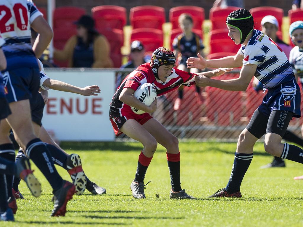 Cooper Collins (left) of Valleys attempts to evade Caiden Bridger of Brothers in under-13 boys Toowoomba Junior Rugby League grand final at Clive Berghofer Stadium, Saturday, September 11, 2021. Picture: Kevin Farmer