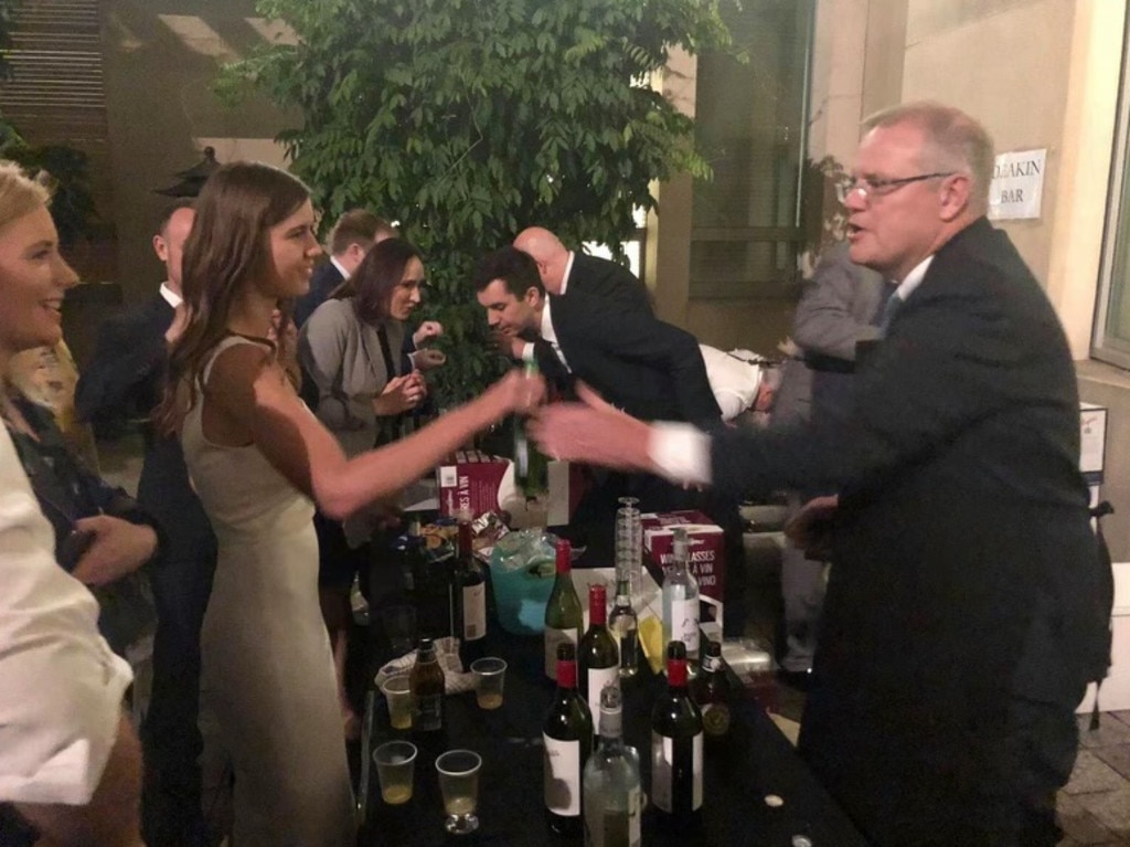 Brittany Higgins pictured with Scott Morrison wearing the white dress she also wore on the night of the alleged incident.