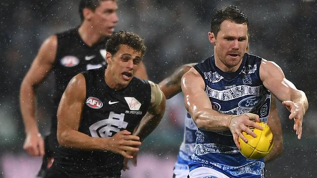 Patrick Dangerfield storms away from Ed Curnow during Geelong’s emphatic win.