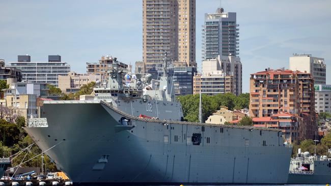 HMAS Canberra, the Royal Australian Navy's latest warship, is berthed at Garden Island naval base in Sydney on November 21, 2014. HMAS Canberra is the Royal Australian Navy's largest and most expensive warship and will be commissioned into service on November 28, 2014. AFP PHOTO/Peter PARKS