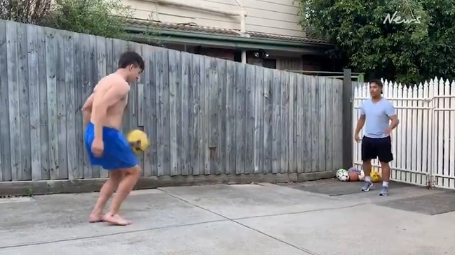 Cassio and son Bernardo Oliveira practice in the backyard during the coronavirus pandemic