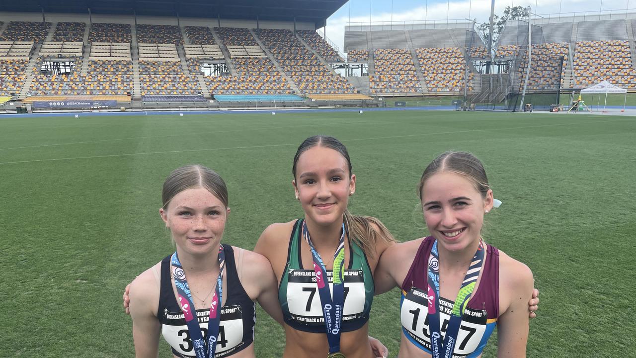 Winner Sienna De Young of St Rita's flanked by Emiliana and Zarayah Williams.