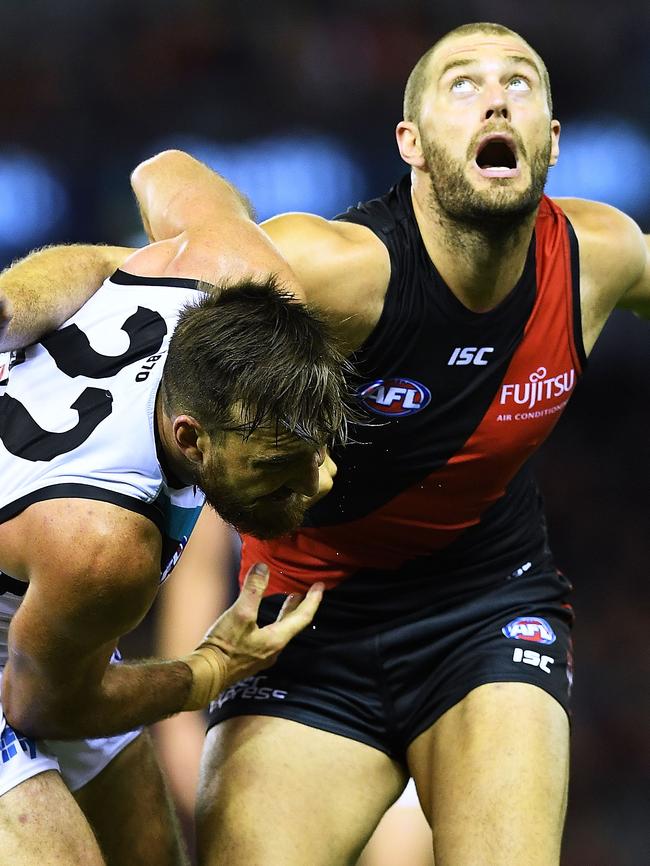 Charlie Dixon wrestles with Tom Bellchambers of Essendon at a boundary throw in. Picture: Mark Brake/Getty Images