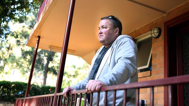 Former homeless man Shane on the balcony of his new home in Riverwood. Picture: Angelo Velardo