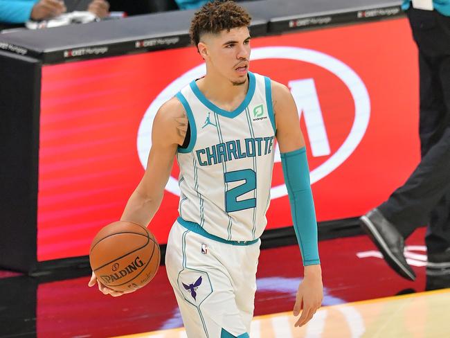 CLEVELAND, OHIO - DECEMBER 23: LaMelo Ball #2 of the Charlotte Hornets looks for a pass during the first quarter against the Cleveland Cavaliers at Rocket Mortgage Fieldhouse on December 23, 2020 in Cleveland, Ohio. NOTE TO USER: User expressly acknowledges and agrees that, by downloading and/or using this photograph, user is consenting to the terms and conditions of the Getty Images License Agreement. (Photo by Jason Miller/Getty Images)