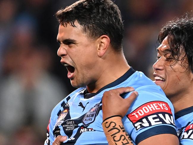 GOLD COAST, AUSTRALIA - JULY 14:  Latrell Mitchell of the Blues celebrates with Brian To'o of the Blues after scoring a try during game three of the 2021 State of Origin Series between the New South Wales Blues and the Queensland Maroons at Cbus Super Stadium on July 14, 2021 in Gold Coast, Australia. (Photo by Bradley Kanaris/Getty Images)