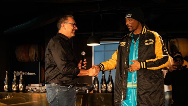 Snoop Dogg meets with Treasury Wine Estates CEO Tim Ford in March, 2023. Snoop Dogg visited the offices of Treasury Wine Estates to meet the CEO and talk about the wine he represents, 19 Crimes. Picture: Supplied