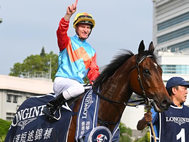 HONG KONG, CHINA - DECEMBER 08: Zac Purton riding Ka Ying Rising after winning Race 5, the Longines Hong Kong Sprint during racing at Sha Tin Racecourse on December 08, 2024 in Hong Kong, China.  (Photo by Vince Caligiuri/Getty Images)