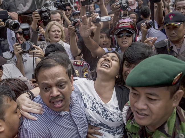 working@news  .. News Corp journalist Cindy Wockner in the media pack  ..  CILACAP, CENTRAL JAVA, INDONESIA - APRIL 28: Brintha Sukumaran (C), a sister of Australian death row prisoner Myuran Sukumaran's screams as she arrives at Wijaya Pura port to visit her brother at Nusakambangan prison ahead of the executions of the Bali 9 on April 28, 2015 in Cilacap, Central Java, Indonesia. Condemned Bali Nine duo Andrew Chan and Myuran Sukumaran have been given 72 hours execution notice. The execution could be held as soon as Tuesday midnight on Nusukamban Island where they have been held, awaiting there fate since March 4th, 2015. Chan and Sukumaran were both sentenced to death after being found guilty of attempting to smuggle 8.3kg of heroin valued at around $4 million from Indonesia to Australia along with 7 other accomplices. (Photo by Ulet Ifansasti/Getty Images)