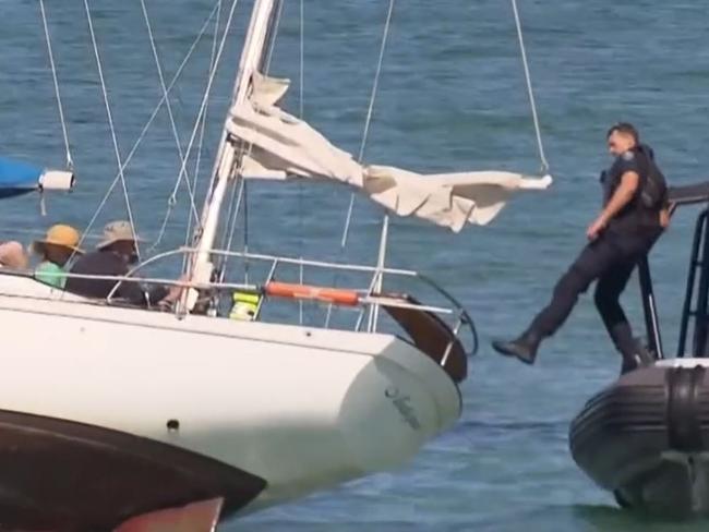 Police rescue some boaties after their yacht becomes stuck on a sandbar off of Semaphore . Picture: 7NEWS