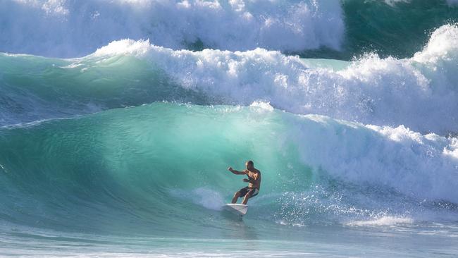 Wild surf.... Bondi local Luke Kennedy enjoys a massive swell on Wednesday. Picture: Jeremy Piper