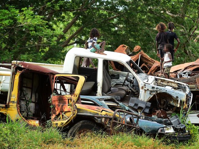  Beswick, 420km from Darwin is a trashed community. Kids play on a pile of wrecked cars on the main road through town. Picture: Justin Kennedy