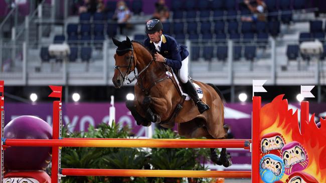 Australia's Kevin McNab riding Don Quidam competes in the equestrian's evening jumping during the Tokyo 2020 Olympic Games at the Equestrian Park in Tokyo on August 2, 2021. (Photo by Behrouz MEHRI / AFP)