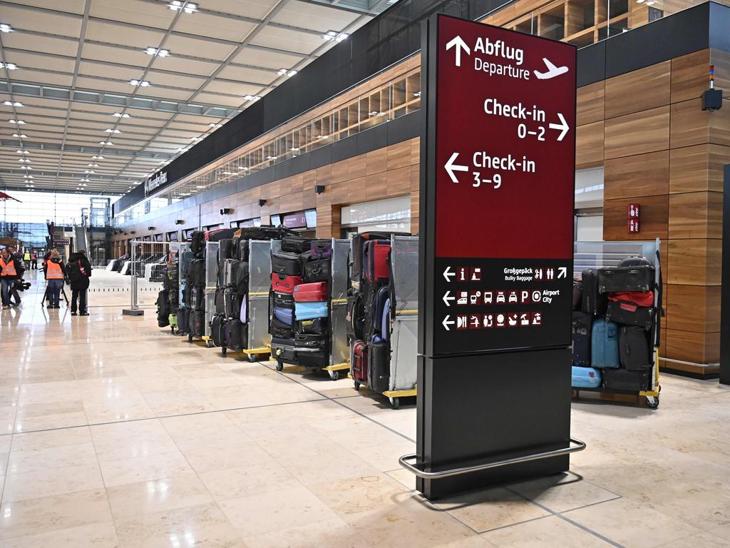 Suitcases are lined up to test the baggage carousel. Picture: Tobias Schwarz/AFP