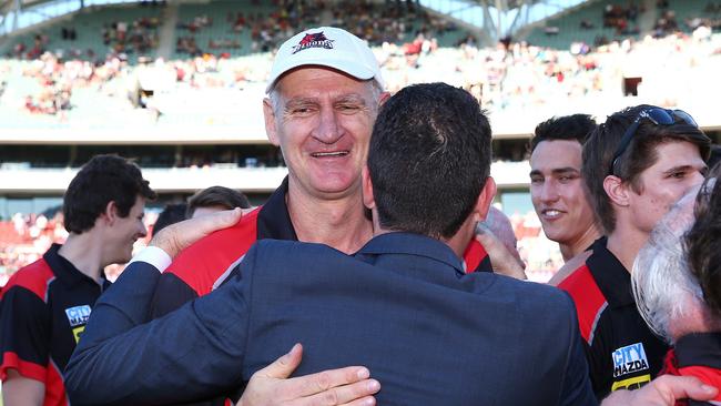 West Adelaide players and officials, including coach Mark Mickan, celebrate the club’s drought-breaking 2015 flag. Picture: Sarah Reed