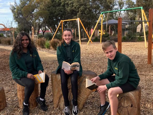 Ascot Park Primary School principal Sam Kennedy with students Tasharah, Charlotte and Lachlan.