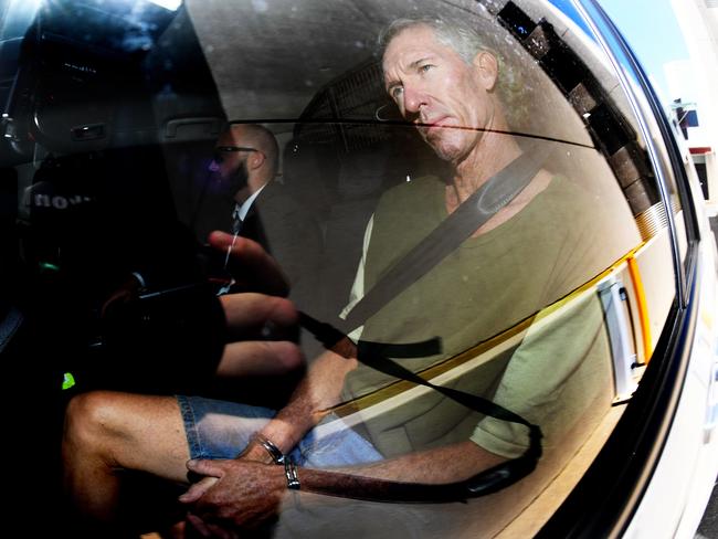 Edward Kenneth Lord is seen in handcuffs as he taken from the Southport Watchhouse on the Gold Coast, Wednesday, March 1, 2017. Lord has been extradited to Tweed Heads, NSW, where he will have charges of negligent driving causing death upgraded to murder, after the car he and his wife Michele were in crashed into the Tweed River in October 2015. (AAP Image/Dave Hunt) NO ARCHIVING