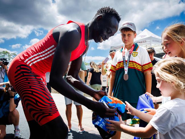 Australia's Gout Gout signs autographs after competing in the men's 200m heats during the Queensland State Championships in Brisbane on March 16 2025. (Photo by Patrick HAMILTON / AFP) / -- IMAGE RESTRICTED TO EDITORIAL USE - STRICTLY NO COMMERCIAL USE --