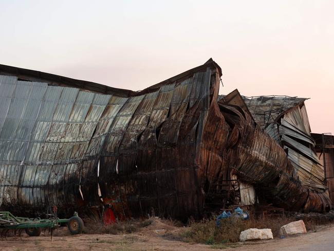 A heavily damaged barn stands in kibbutz Alumim, following the October 7 attack by Hamas fighters. Picture: AFP