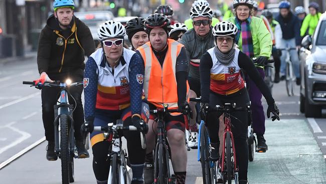 Members of Melbourne's Bicycle Network ride past a memorial for Dutch cyclist Gitta Scheenhouwer in South Yarra in Melbourne this morning Picture: AAP.